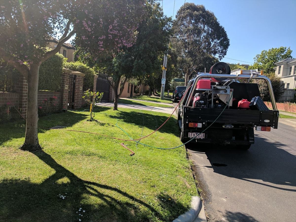 Plumbing on the Peninsula work ute set up on a residential street