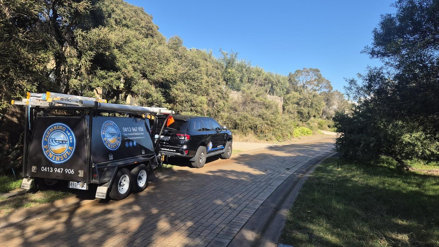 Plumbing on the Peninsula ute and trailer on site