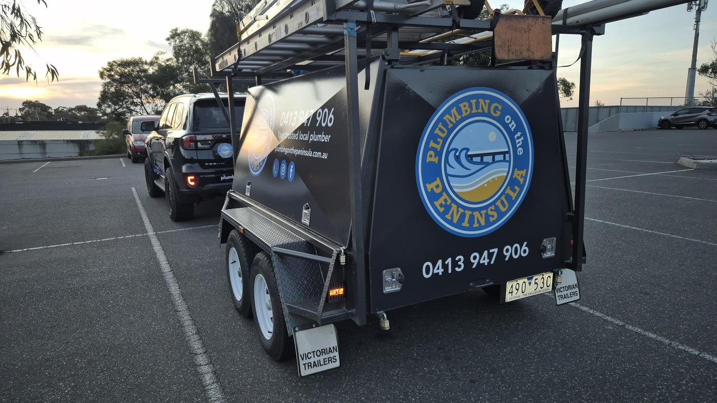Plumbing on the Peninsula branded work trailer